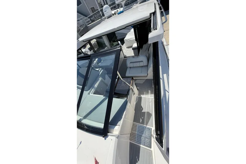 Slide: The Image of 2026 Regal 36 XO yacht interior with modern seating and sleek design. - 70