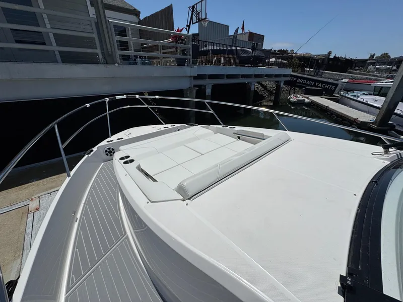 Slide: The Image of 2026 Regal 36 XO yacht with spacious sunbathing deck at marina. - 72