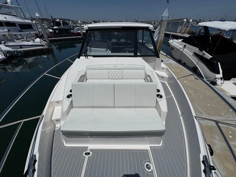 Slide: The Image of 2026 Regal 36 XO yacht with sleek design docked at marina. - 74