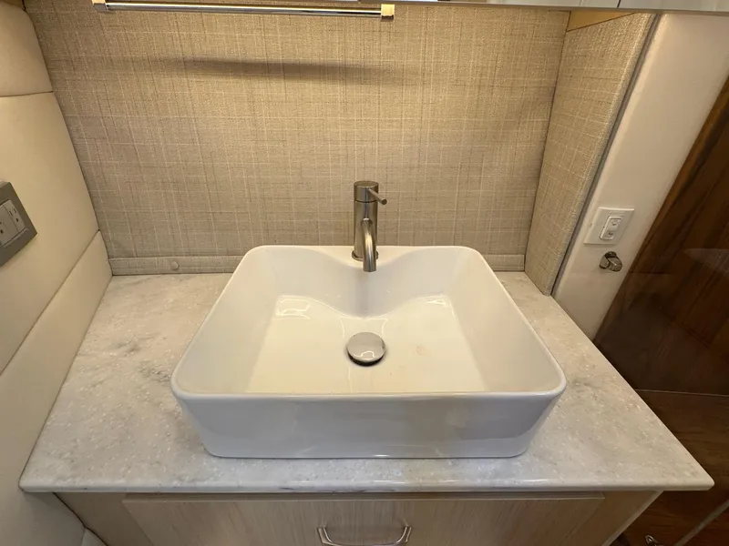 Slide: The Image of Modern square sink on marble countertop in 2026 Regal 36 XO yacht bathroom. - 80