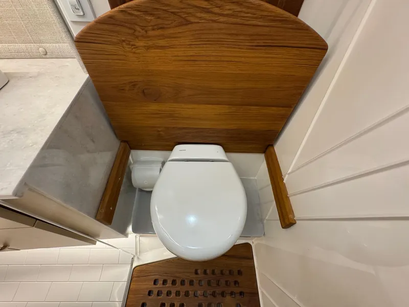 Slide: The Image of Modern bathroom in 2026 Regal 36 XO yacht with wooden accents and sleek design. - 83