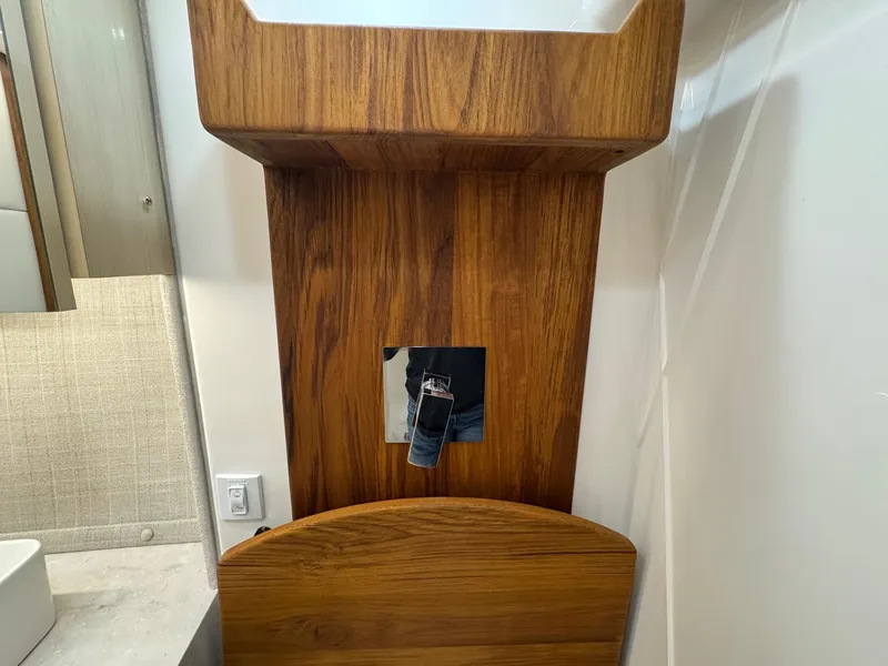 Slide: The Image of Wooden interior detail of a 2026 Regal 36 XO boat, featuring a modern design. - 84