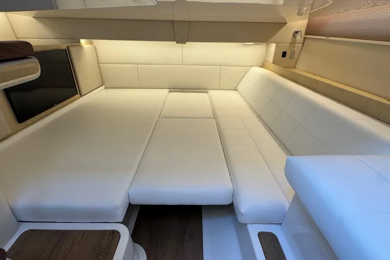 Slide: The Image of Luxurious interior of 2026 Regal 36 XO yacht with white leather seating. - 96