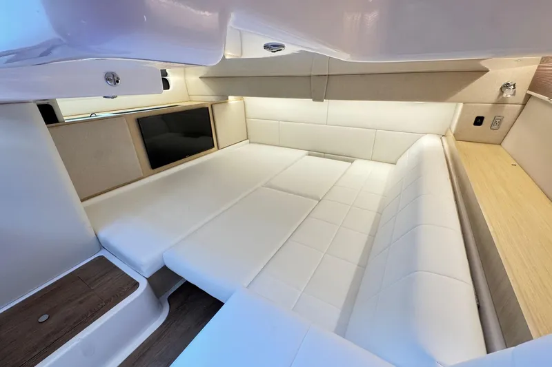 Slide: The Image of Luxurious interior of 2026 Regal 36 XO yacht with white seating and modern design. - 97