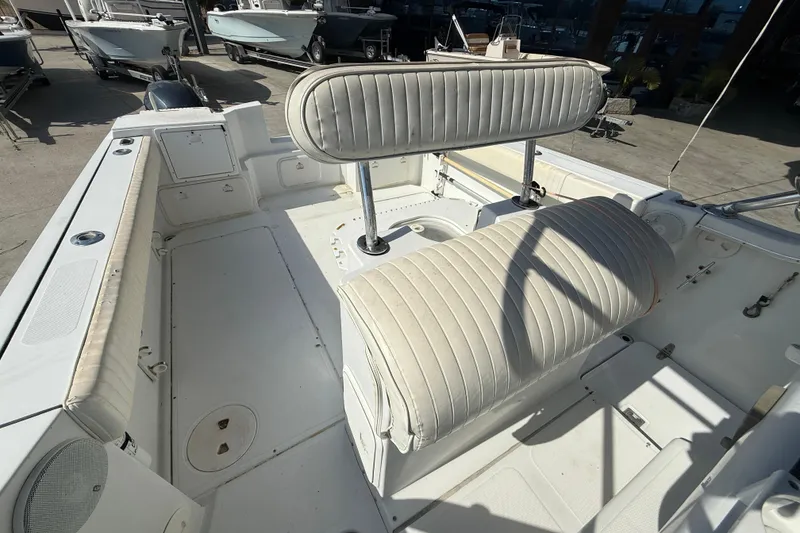 Slide: The Image of 2004 Glacier Bay 260 Canyon Runner boat interior with seating and storage compartments. - 11