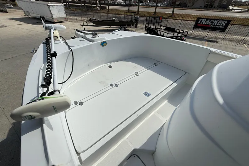 Slide: The Image of 2004 Glacier Bay 260 Canyon Runner boat deck with trolling motor, parked outdoors. - 9