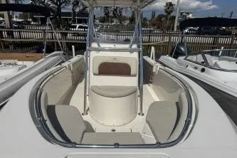Slide: The Image of 2022 Cobia 237 Center Console boat with spacious seating and sleek design. - 3