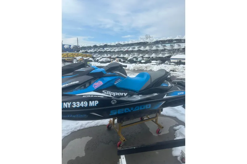 Slide: The Image of 2019 Sea-Doo GTR 230 jet ski in snowy storage lot. - 7