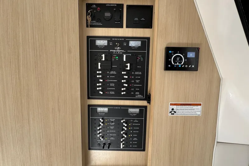 Slide: The Image of Control panel of 2026 Regal 33 XO boat with switches and digital display. - 138