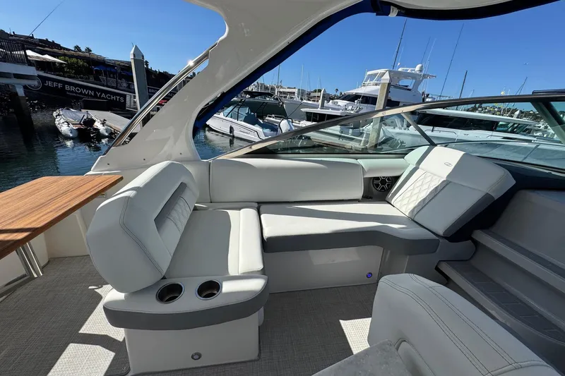 Slide: The Image of Luxurious interior of 2026 Regal 33 XO yacht with elegant seating and wooden table. - 45