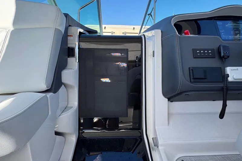 Slide: The Image of Interior view of 2026 Regal 33 XO boat cockpit with modern controls and seating. - 72