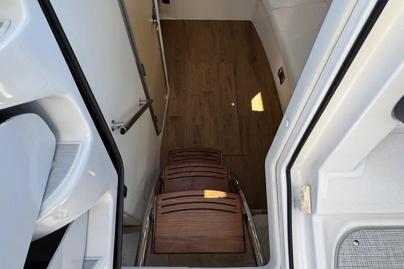 Slide: The Image of Interior view of 2026 Regal 33 XO yacht with wooden steps and sleek design. - 73