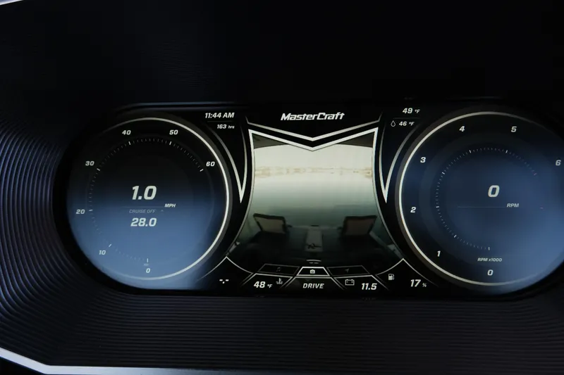 Slide: The Image of Dashboard of 2020 MasterCraft XT25 boat showing speed, RPM, and camera display. - 13