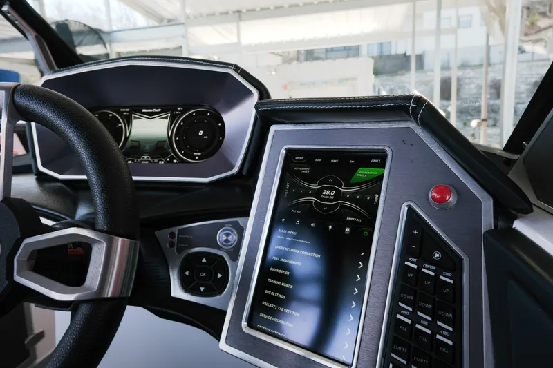 Slide: The Image of 2020 MasterCraft XT25 dashboard with advanced touchscreen controls and steering wheel. - 15