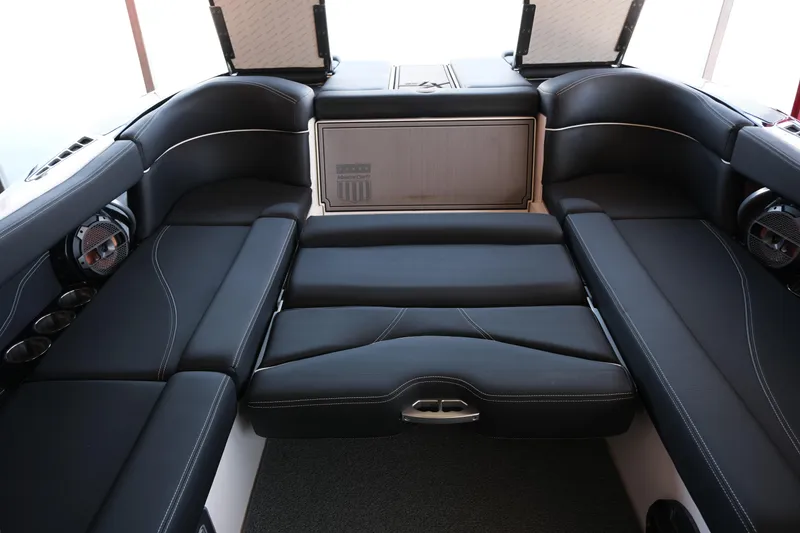 Slide: The Image of 2020 MasterCraft XT25 boat interior with luxurious black seating and modern design. - 18