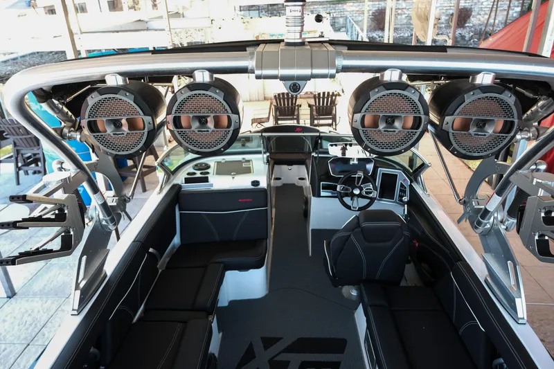 Slide: The Image of 2020 MasterCraft XT25 boat interior with advanced audio system and sleek design. - 6