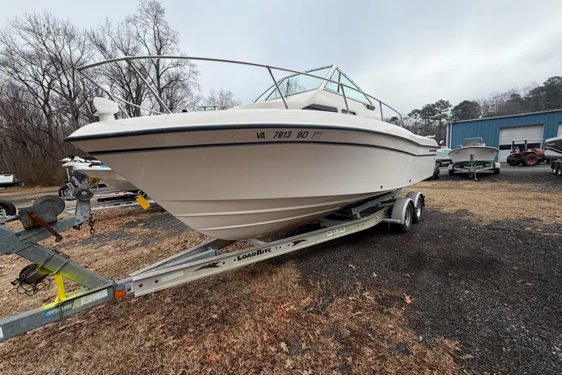 Slide: The Image of 2004 Grady-White Gulfstream 232 boat on trailer, parked outdoors. - 3