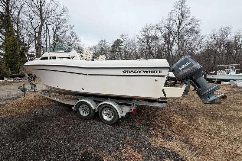 Slide: The Image of 2004 Grady-White Gulfstream 232 boat on trailer with Yamaha outboard motor. - 4