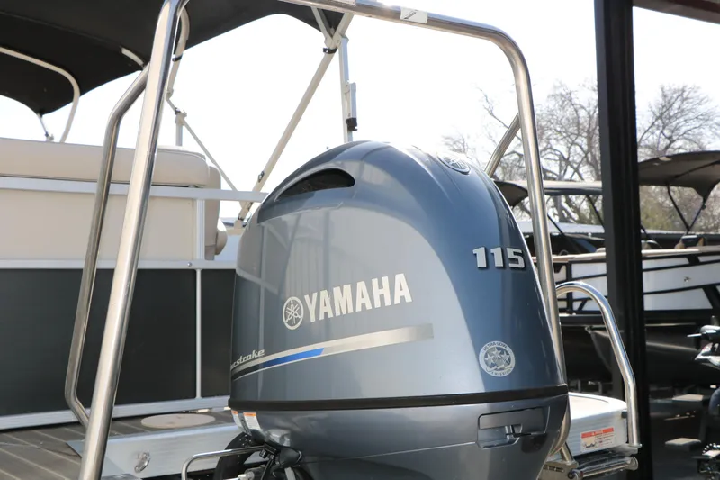 Slide: The Image of 2015 Bennington 21 SLX with Yamaha 115 outboard motor, docked and ready for use. - 15