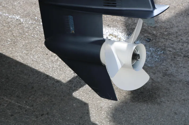 Slide: The Image of Propeller of a 2015 Bennington 21 SLX boat on wet pavement. - 16