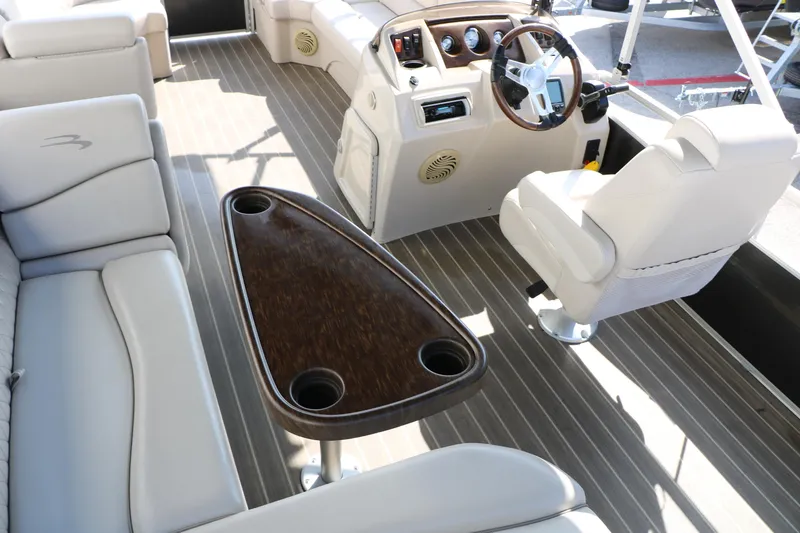 Slide: The Image of 2015 Bennington 21 SLX boat interior with steering console and seating area. - 31