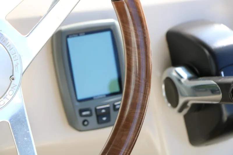 Slide: The Image of Close-up of 2015 Bennington 21 SLX boat steering wheel and control panel. - 40