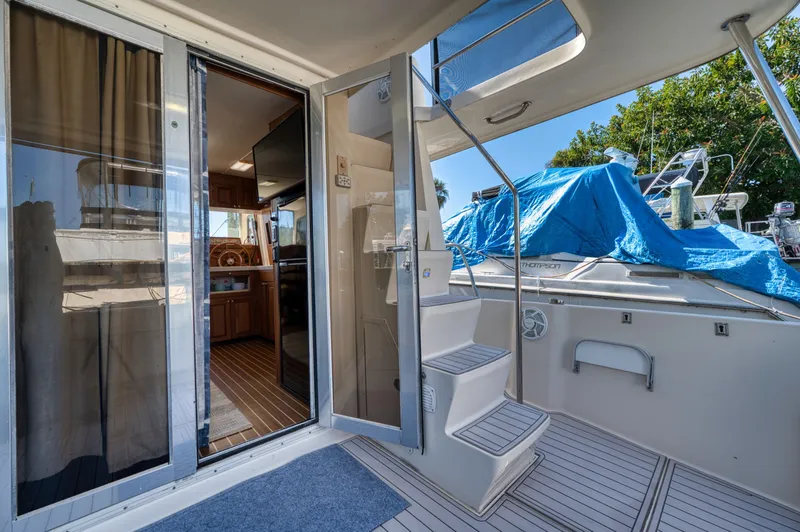 Slide: The Image of Mainship 400 Trawler 2005, interior view with stairs and kitchen. - 14