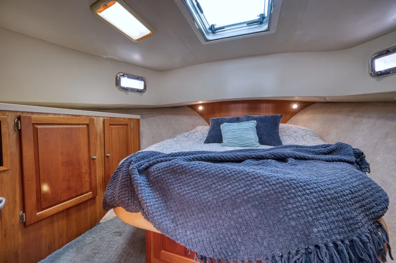 Slide: The Image of Interior of 2005 Mainship 400 Trawler with cozy bed. - 24