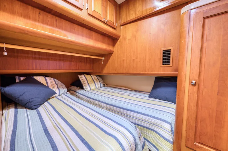 Slide: The Image of Interior of 2005 Mainship 400 Trawler with twin beds. - 27