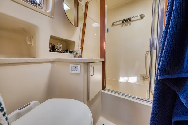 Slide: The Image of Bathroom in 2005 Mainship 400 Trawler with shower and toilet. - 28