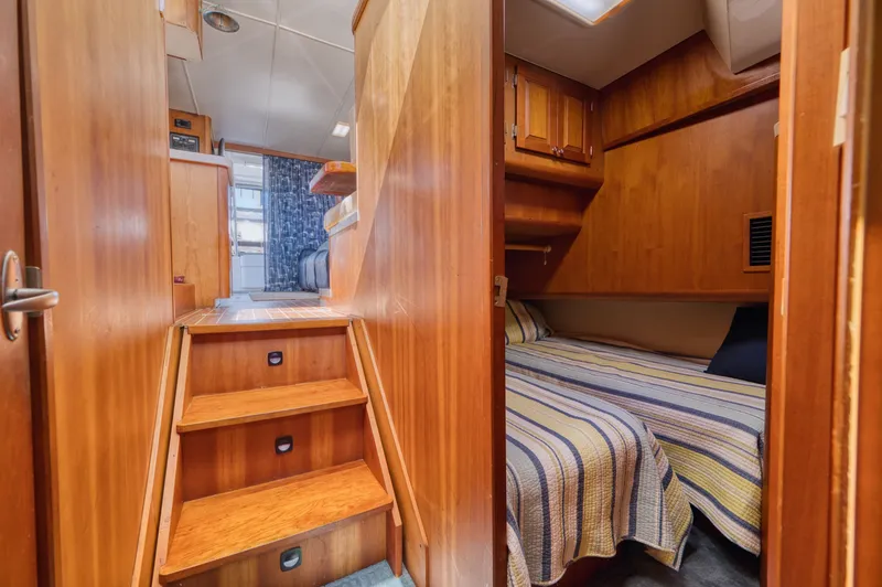 Slide: The Image of Interior of 2005 Mainship 400 Trawler with wood finish. - 29