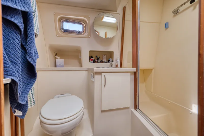 Slide: The Image of Bathroom in 2005 Mainship 400 Trawler with shower and toilet. - 30