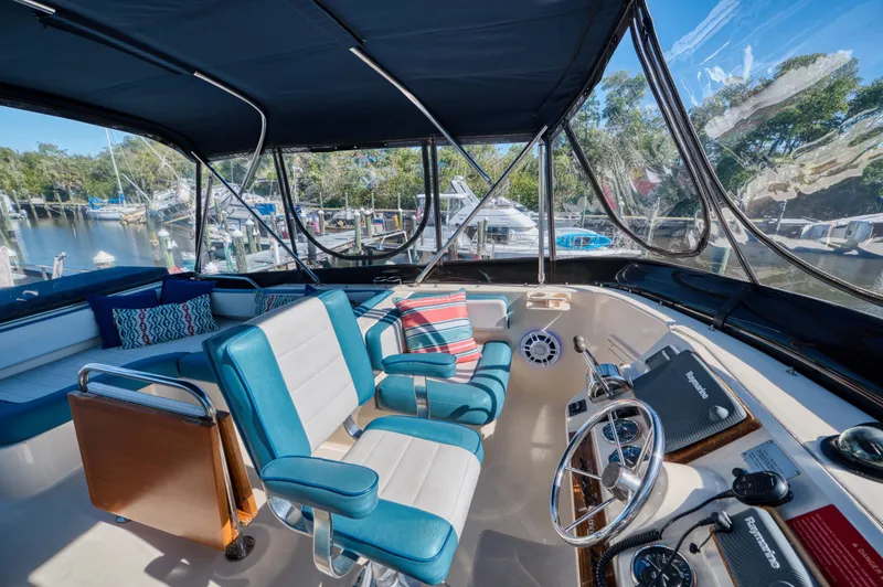 Slide: The Image of Interior of a 2005 Mainship 400 Trawler with blue seating. - 43