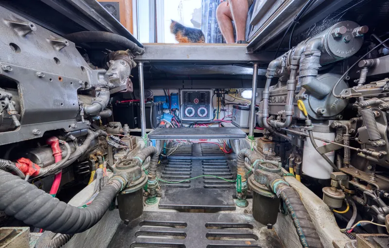 Slide: The Image of Engine room of a 2005 Mainship 400 Trawler with technical details. - 44