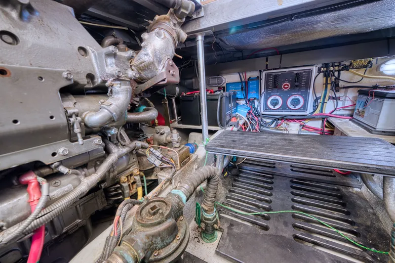 Slide: The Image of Engine room of a 2005 Mainship 400 Trawler with technical details. - 45