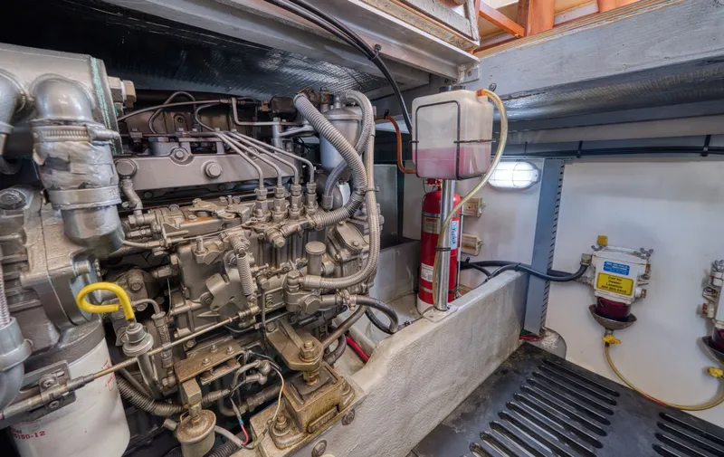 Slide: The Image of Engine room of a 2005 Mainship 400 Trawler with technical details. - 46