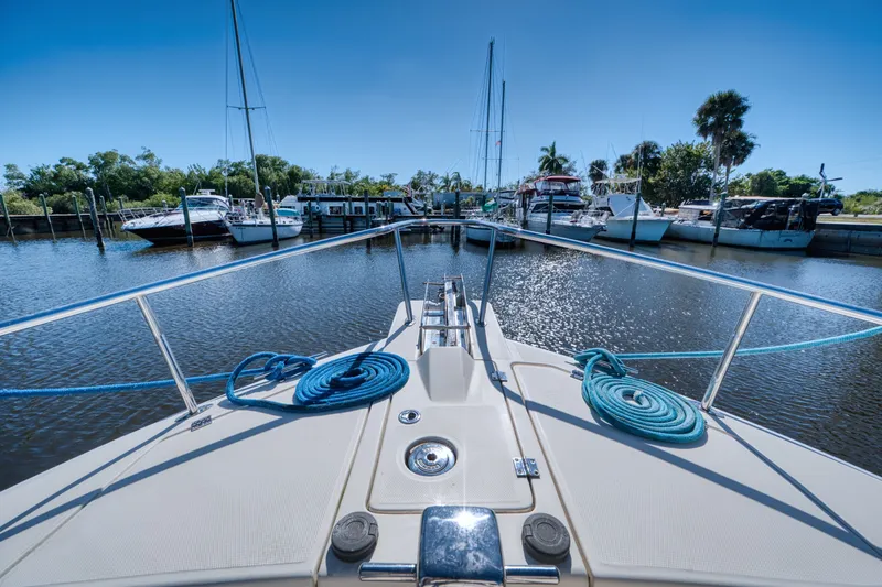 Slide: The Image of Mainship 400 Trawler 2005 docked with blue ropes. - 7