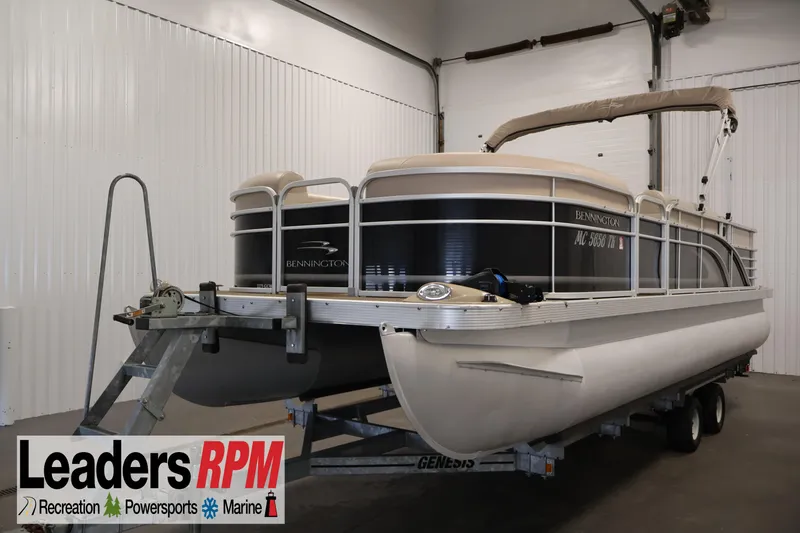 Slide: The Image of 2012 Bennington 2275 GCW pontoon boat on trailer in indoor storage. - 1