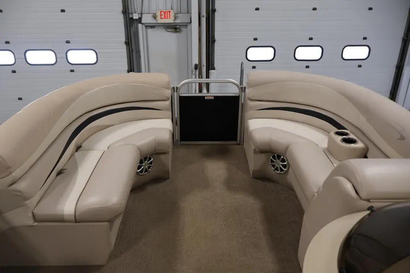 Slide: The Image of Interior of 2012 Bennington 2275 GCW pontoon boat with beige seating and cup holders. - 12