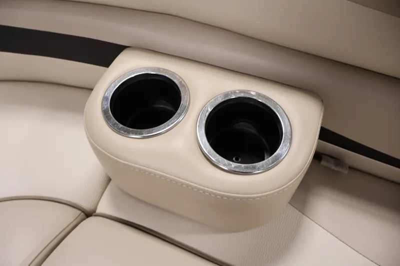 Slide: The Image of 2012 Bennington 2275 GCW boat cup holders in beige leather interior. - 17