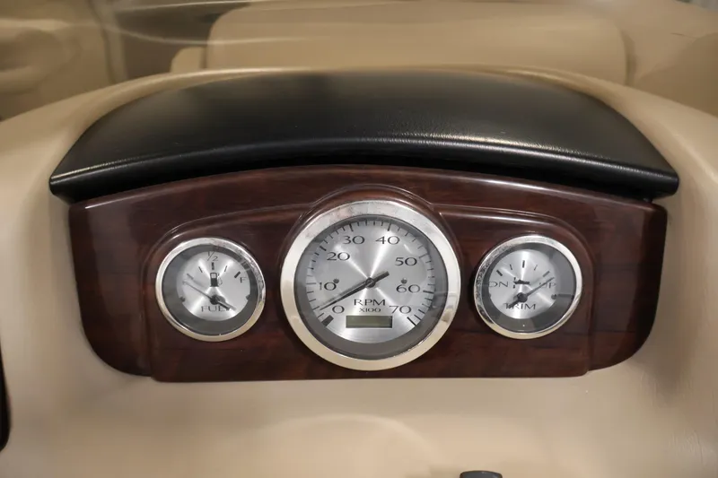 Slide: The Image of Dashboard gauges of a 2012 Bennington 2275 GCW boat, featuring RPM, fuel, and trim indicators. - 24