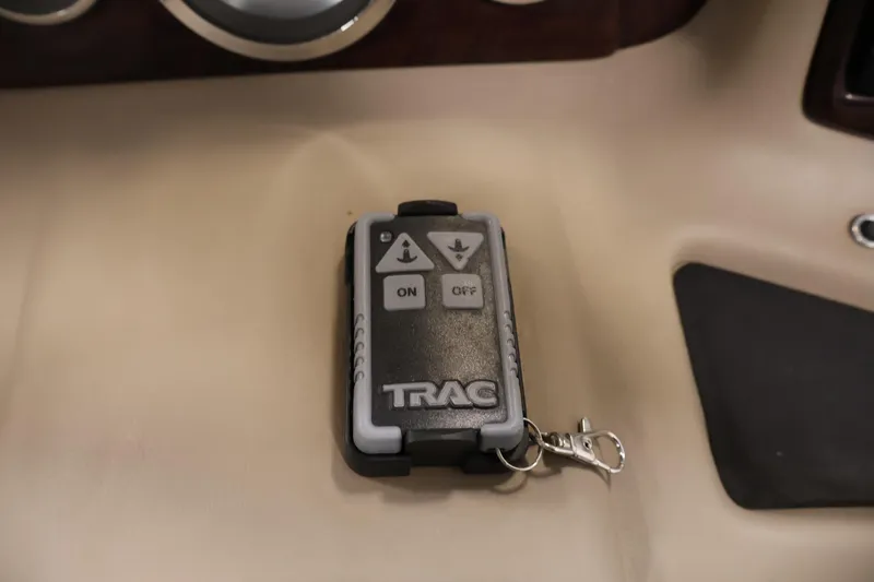 Slide: The Image of Remote control for TRAC system on 2012 Bennington 2275 GCW boat dashboard. - 27