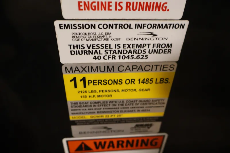 Slide: The Image of 2012 Bennington 2275 GCW capacity and emission control labels, maximum 11 persons or 1485 lbs. - 31