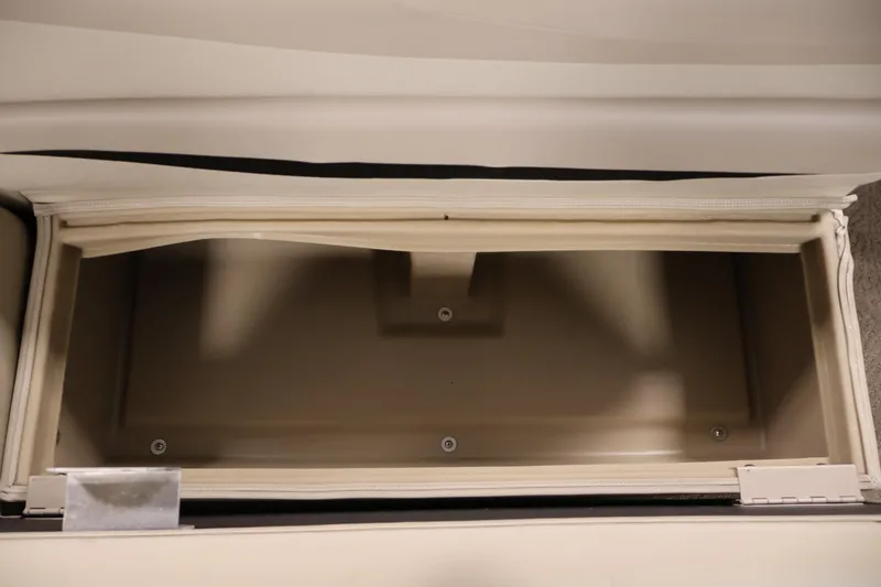 Slide: The Image of Open storage compartment in 2012 Bennington 2275 GCW boat, beige interior. - 35