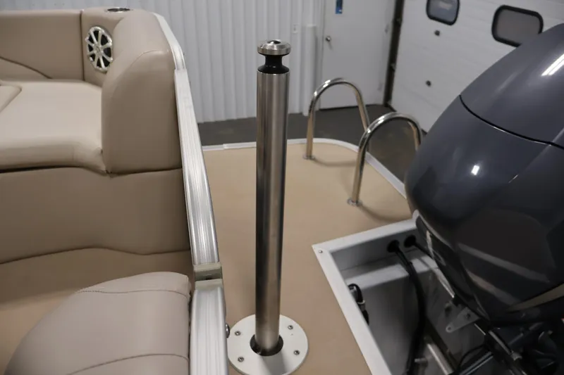 Slide: The Image of 2012 Bennington 2275 GCW boat interior with seating, motor, and stainless steel railing. - 38