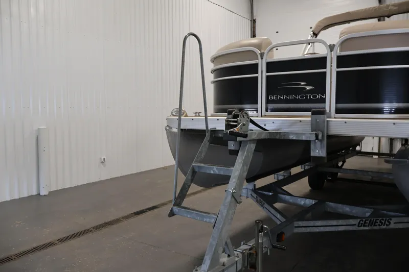 Slide: The Image of 2012 Bennington 2275 GCW pontoon boat on trailer in indoor storage. - 43