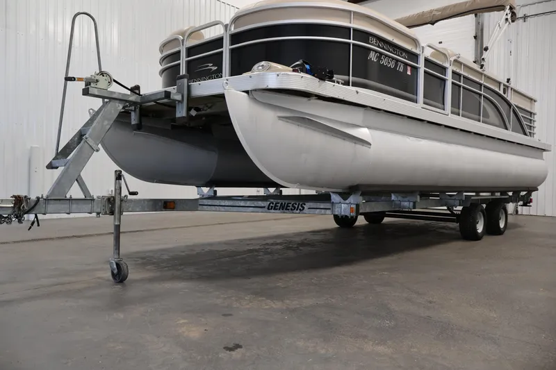 Slide: The Image of 2012 Bennington 2275 GCW pontoon boat on Genesis trailer in indoor storage. - 44