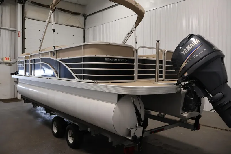 Slide: The Image of 2012 Bennington 2275 GCW pontoon boat with Yamaha engine in indoor storage. - 7