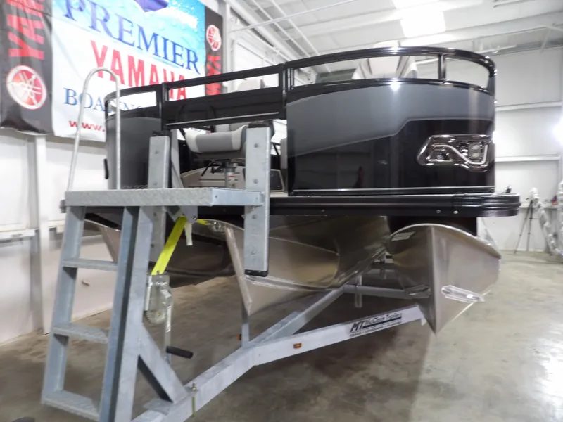 Slide: The Image of 2025 Avalon VNT85 CC 23T pontoon boat in a workshop. - 8