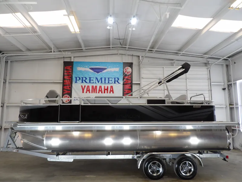 Slide: The Image of 2026 Avalon Venture 85 Quad Fish boat in a showroom. - 1